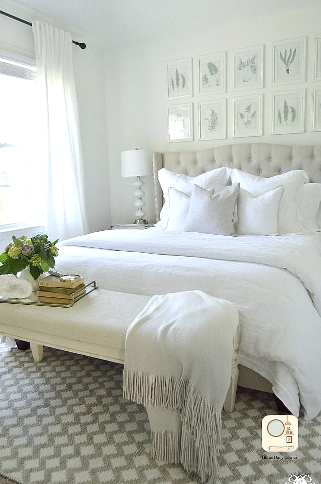16 Guest Bedroom Decor Designs That Maximize Style and Function 14 Gallery Wall with Rotating Art