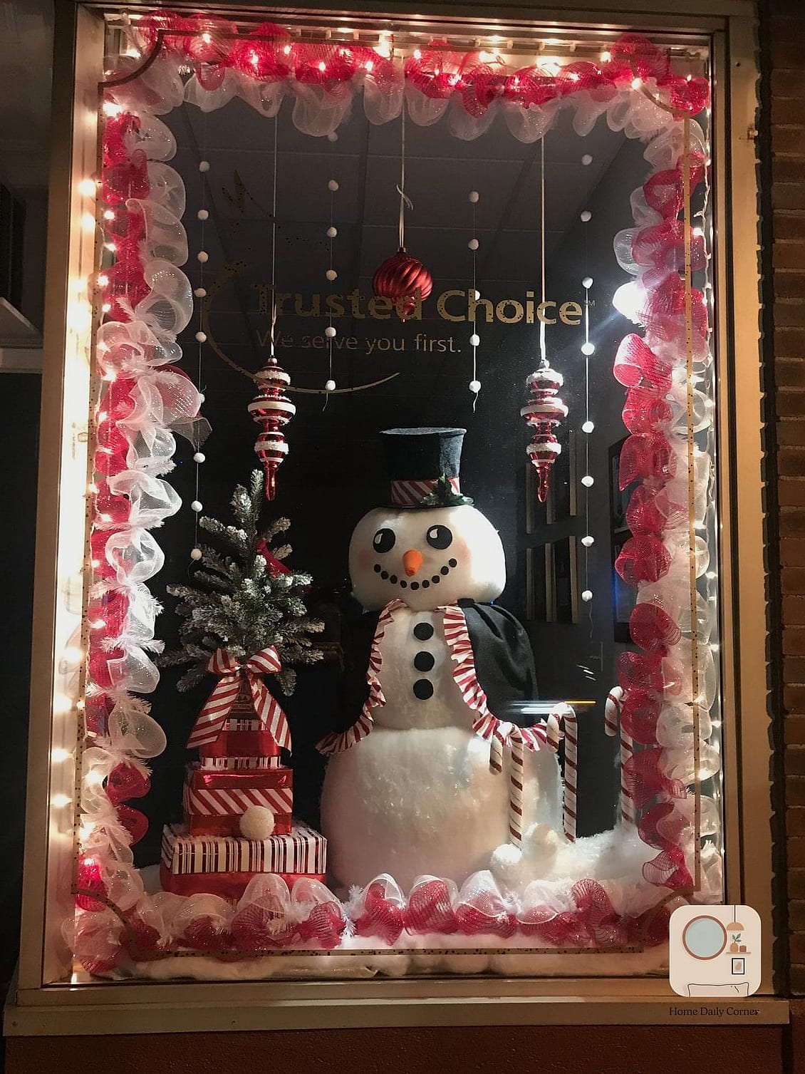 A Window Display with Faux Snow and Lights